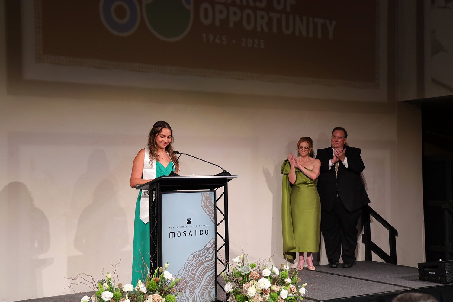 female student smiling at podium