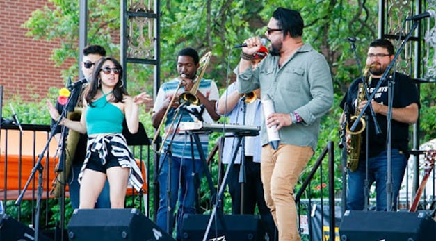 Music band performing on stage at the Fredstock Fiesta Event
