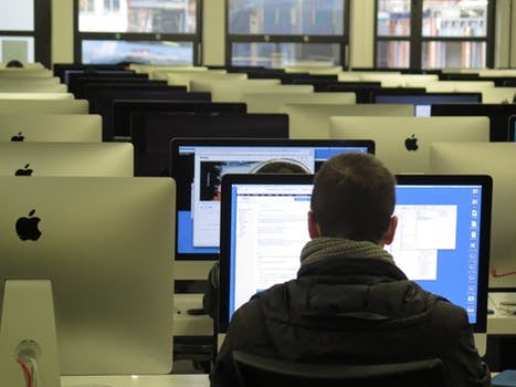 student with computer